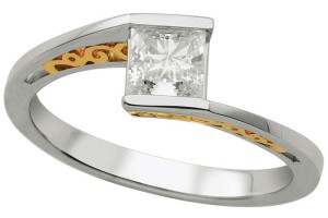 Two-tone 14-karat gold solitaire diamond engagement ring by Master Design, with one-carat Canadian diamond.