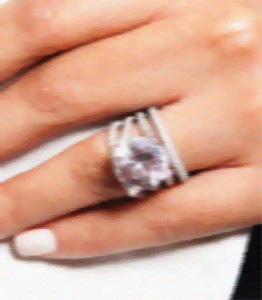 This blurry photo taken with a phone camera of an actress's hand  on television is all I had to go on to design a ring for my customer.