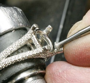 A 45 degree bearing bur was used to cut individual seats in each prong.