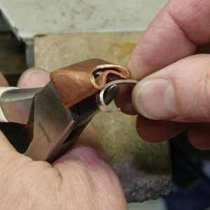 A copper shield surrounding the plier jaws can protect platinum from denting.