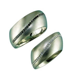 Offset bands offer a more interesting twist on the classic gold wedding ring. The amount of offset can be fitted to the actual shape of the client's hand.