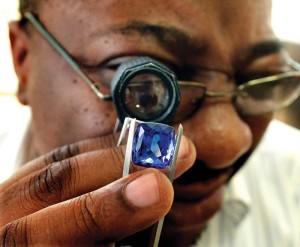 A cutter examines tanzanite in Arusha, Tanzania.