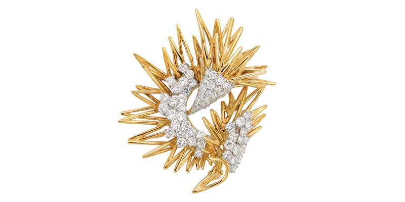 18-karat gold and diamond zigzag wire brooch by Kutchinsky.