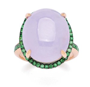 A lavender jadeite cabochon ring, with contrasting deep-green tsavorite garnet trim.