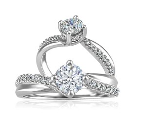 19-karat white gold ring by Beverly Hills Jewellers, with .70-carat round Canadian diamond centre and diamond sides.