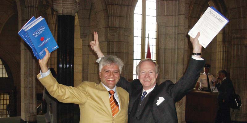 Pierre Akkelian (left) and Jonathan Birks celebrate in Parliament, following the vote to repeal the jewellery excise tax.