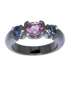 An engagement ring featuring the birthstones of the bride and groom.