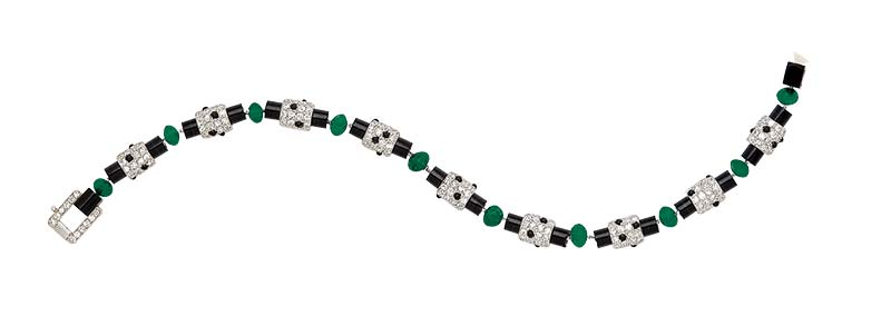 Signed art deco emerald, onyx, and diamond bracelet, circa 1920, by Cartier.