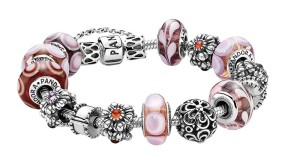 Bracelet by Pandora Jewelry, with beads featuring sterling silver, Murano glass, and gemstones.