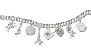 Bracelet and assorted charms in sterling silver by Rembrandt Charms.