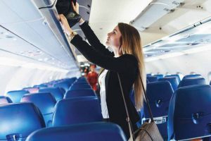 When travelling by air, if your line does not fit under the seat in front of you, it is a good idea to store it in the overhead bin and take an aisle seat.