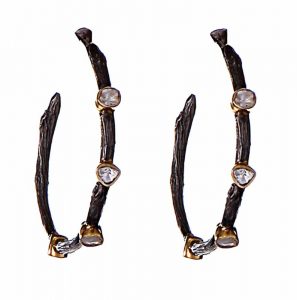 Black-plated earrings inspired by the concept of the circle of life, made in 18-karat gold, sterling silver, and sliced diamonds, by Neeta Gupta. MSRP $1899