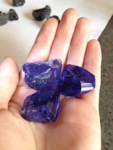 Heated tanzanite rough specimens. Tanzania's president recently announced a new source of this gem had been found.