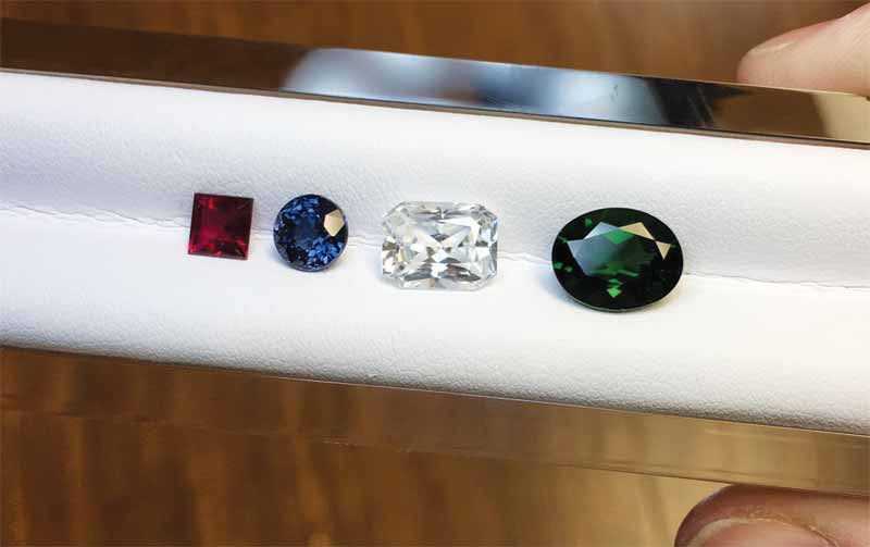 From left to right: rubellite, spinel, zircon, and diopside.