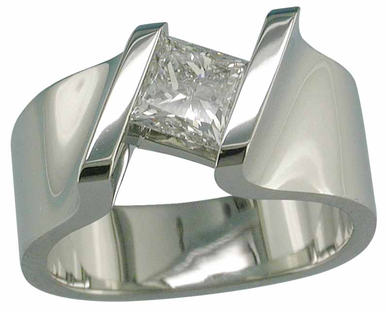 A 19-karat white gold ring that is channel-set with a princess-cut diamond.