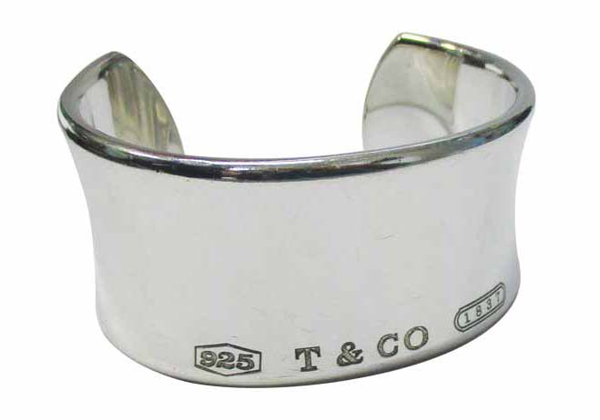 Appraisers should have extensive knowledge of famous designers, along with their authentic trademarks and master design concepts. The branding on this Tiffany cuff bracelet shows the piece is authentic.