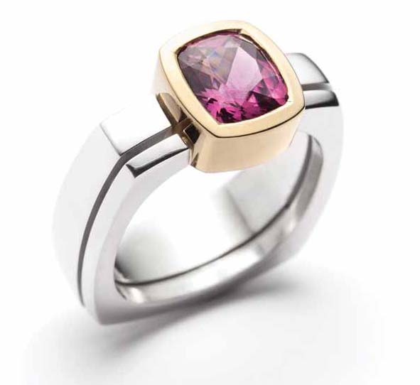 18-karat gold and 925 silver ring by Christine Dwane, featuring a rhodolite garnet centre stone.