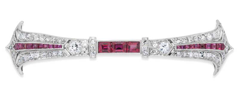 Ruby, diamond, and platinum bar brooch.