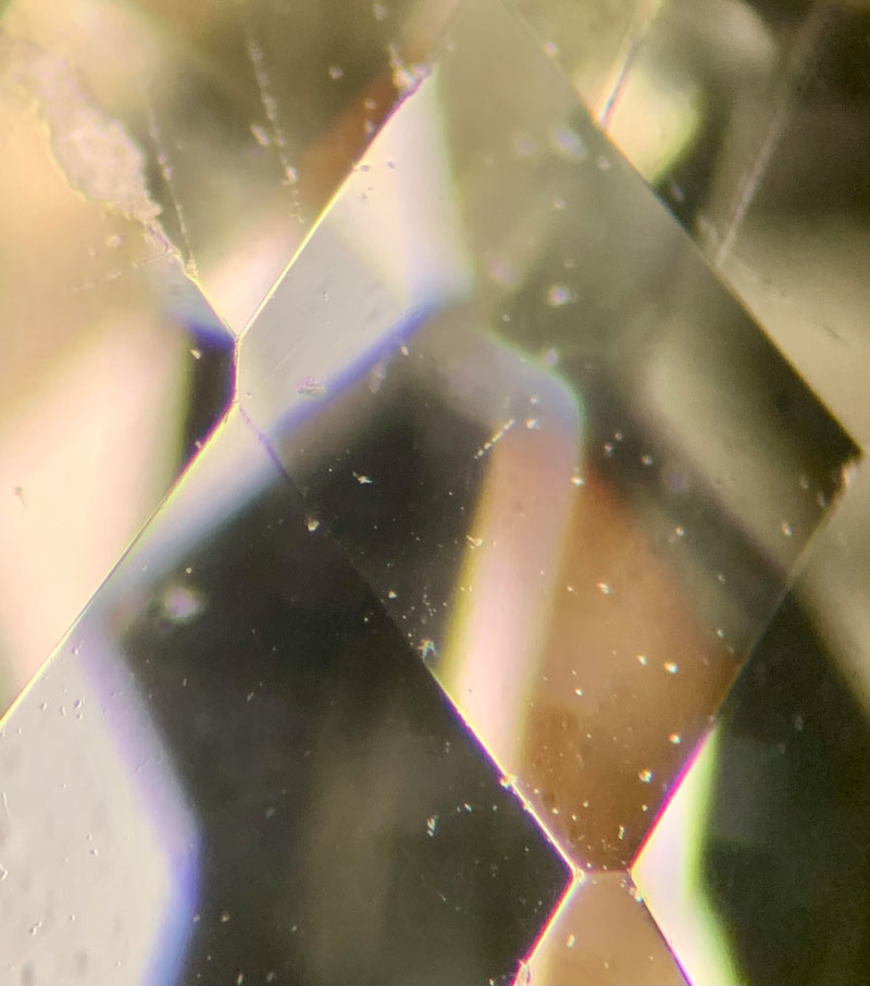 ‘Bread crumb’ inclusions visible in synthetic quartz (citrine variety), created using the hydrothermal growth method.