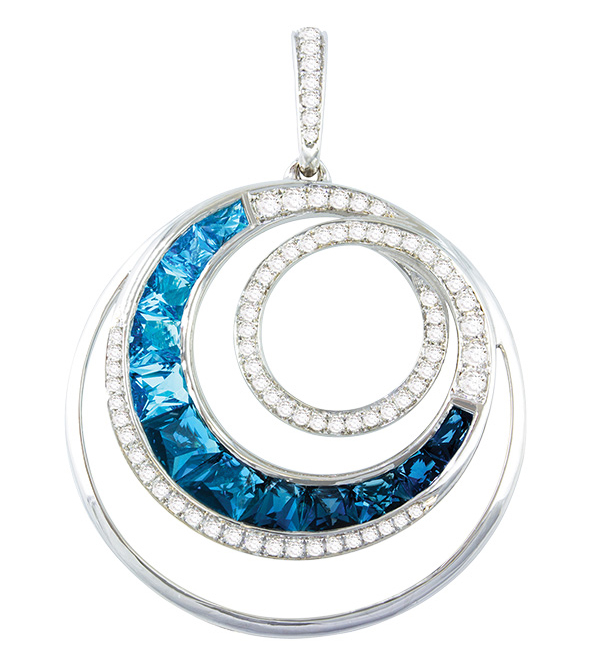 14-karat white gold pendant from Bellarri’s ‘Malibu Wave Collection,’ featuring graduated channel-set London and Swiss blue topaz gemstones and diamond accents.