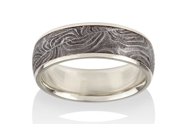 Damascus steel and palladium 500 ring by Chris Ploof Designs, crafted from a Belgian-made shotgun barrel (circa 1870).