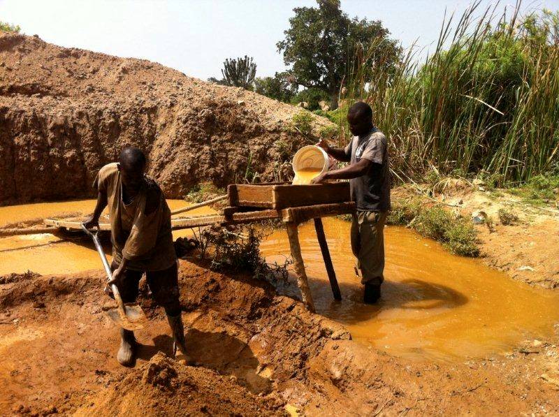 A pair of small-scale gold miners toil in the Kenyan sun.