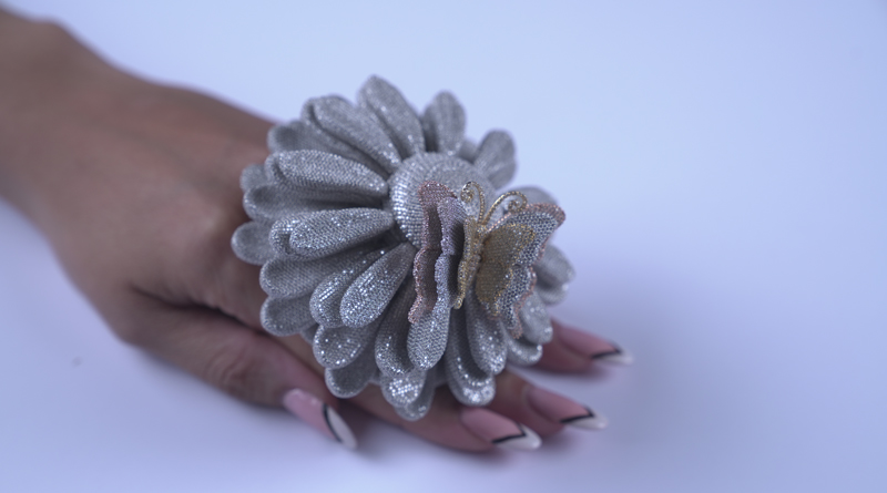 A sunflower-inspired ring showcasing 50,907 diamonds has broken a Guinness World Record.