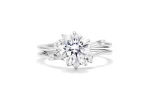 14-karat white gold ‘Scattered Blooms Undulated’ diamond engagement ring by James Allen. Pictured with matching band.  MSRP $1,110 (setting price); $768 (band)