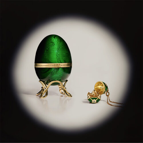 The egg on a gold stand and the locket. 