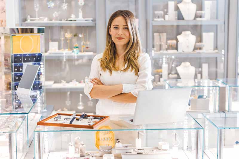 Jewellery store employee behind the counter